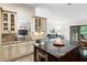 Kitchen island with storage, sink and dishwasher, stainless appliances, and hardwood floors at 4030 Muirfield Ln, Marietta, GA 30068