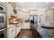 Kitchen with stainless appliances, granite countertops, custom cabinetry, and hardwood floors at 4030 Muirfield Ln, Marietta, GA 30068