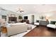 Cozy living room featuring light walls, hardwood floors, and a brick fireplace at 4030 Muirfield Ln, Marietta, GA 30068