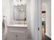 Bright powder room featuring a modern vanity with granite countertop and a stainless steel framed mirror at 4030 Muirfield Ln, Marietta, GA 30068