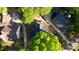 Aerial view showcases the home's layout, driveway, and surrounding greenery of the property at 4157 Town Branch Ct Sw, Covington, GA 30014