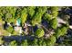 Aerial view showcases the neighborhood layout, including the streets, trees, houses and swimming pool at 4157 Town Branch Ct Sw, Covington, GA 30014
