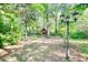 A wooden cabin situated in a backyard that is surrounded by lush greenery and trees at 4157 Town Branch Ct Sw, Covington, GA 30014