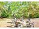 Fire pit and seating in a wooded backyard at 4157 Town Branch Ct Sw, Covington, GA 30014