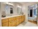 Bathroom vanity with double sinks and a view to the bedroom at 4157 Town Branch Ct Sw, Covington, GA 30014