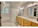Bright bathroom with double sink vanity and ample storage at 4157 Town Branch Ct Sw, Covington, GA 30014