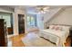 Inviting bedroom with hardwood floors, a window seat, and a cozy atmosphere at 4157 Town Branch Ct Sw, Covington, GA 30014
