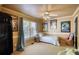 Inviting bedroom features a daybed, ample natural light and neutral color scheme with charming decorative accents at 4157 Town Branch Ct Sw, Covington, GA 30014