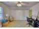 Bedroom with neutral walls, patterned carpet, and ceiling fan at 4157 Town Branch Ct Sw, Covington, GA 30014