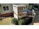 Two-story deck featuring wood railing and privacy lattice, outdoor seating area, and under deck storage at 4157 Town Branch Ct Sw, Covington, GA 30014