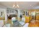 Open concept with a dining room flowing into the living spaces, highlighted by hardwood floors at 4157 Town Branch Ct Sw, Covington, GA 30014