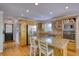 Bright kitchen with granite counters, stainless steel appliances, and light wood cabinets at 4157 Town Branch Ct Sw, Covington, GA 30014