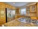Kitchen featuring granite countertops, stainless steel appliances, and light wood cabinetry at 4157 Town Branch Ct Sw, Covington, GA 30014