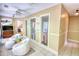 Bright sitting area featuring tile floors and two white, comfortable chairs at 4157 Town Branch Ct Sw, Covington, GA 30014
