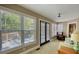 Relaxing sunroom with large windows offering abundant natural light and views of the outdoors at 4157 Town Branch Ct Sw, Covington, GA 30014