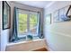 Charming window seat with bright cushions and natural light at 4157 Town Branch Ct Sw, Covington, GA 30014
