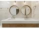 Elegant bathroom with double sinks, quartz countertop, and modern fixtures at 72 Ivy Ne Pkwy, Atlanta, GA 30342