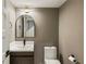 Half-bathroom featuring modern fixtures, a stylish vanity, and clean design elements at 72 Ivy Ne Pkwy, Atlanta, GA 30342