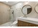 Modern bathroom with walk-in shower, tile surround, and stylish vanity at 72 Ivy Ne Pkwy, Atlanta, GA 30342