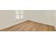 Well-lit bedroom with shutters and beautiful hardwood flooring at 72 Ivy Ne Pkwy, Atlanta, GA 30342
