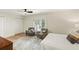 Serene bedroom with shuttered windows, seating area, and ample closet space at 72 Ivy Ne Pkwy, Atlanta, GA 30342
