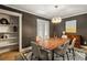 Beautiful dining room features a modern chandelier, wooden table, and stylish decor at 72 Ivy Ne Pkwy, Atlanta, GA 30342