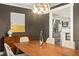 Formal dining room featuring a modern chandelier and decorative sideboard at 72 Ivy Ne Pkwy, Atlanta, GA 30342