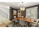 Modern dining room with dark walls, chandelier, and seating for six at 72 Ivy Ne Pkwy, Atlanta, GA 30342