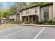 Two-story condo with well-maintained landscaping and ample parking spaces at 72 Ivy Ne Pkwy, Atlanta, GA 30342