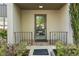 Inviting front door with well-kept landscaping and brick porch at 72 Ivy Ne Pkwy, Atlanta, GA 30342