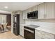 Modern kitchen with stainless steel appliances, light countertops, and new cabinets at 72 Ivy Ne Pkwy, Atlanta, GA 30342