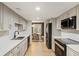Chic kitchen with modern stainless steel appliances and open to dining area at 72 Ivy Ne Pkwy, Atlanta, GA 30342