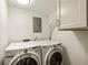Clean and functional laundry area showcasing a washer, dryer, and upper storage at 72 Ivy Ne Pkwy, Atlanta, GA 30342