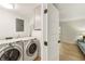 Well-equipped laundry room with modern washer and dryer units, as well as extra storage at 72 Ivy Ne Pkwy, Atlanta, GA 30342