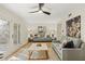 Bright living room with hardwood floors, neutral decor, and access to outdoor space at 72 Ivy Ne Pkwy, Atlanta, GA 30342