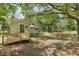 Backyard featuring a fenced-in yard, patio and mature trees at 1545 Orlando Sw St, Atlanta, GA 30311