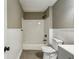 Renovated bathroom features subway tiles, modern fixtures, and a bathtub and shower combination at 1545 Orlando Sw St, Atlanta, GA 30311