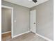 Neutral bedroom featuring modern ceiling fan, fresh paint, and wood-look flooring at 1545 Orlando Sw St, Atlanta, GA 30311