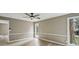 Bright bedroom featuring hardwood floors, a ceiling fan, and a private balcony at 1545 Orlando Sw St, Atlanta, GA 30311