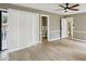 Bright bedroom featuring a ceiling fan and access to the outdoors at 1545 Orlando Sw St, Atlanta, GA 30311