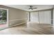 Bright bedroom features hardwood floors, a ceiling fan, and access to the backyard at 1545 Orlando Sw St, Atlanta, GA 30311