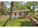 Charming single-story home with a cozy front porch and well-maintained landscaping at 1545 Orlando Sw St, Atlanta, GA 30311