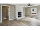 Spacious living room featuring a fireplace, hardwood floors, and natural light at 1545 Orlando Sw St, Atlanta, GA 30311