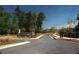 Stone community entrance sign with manicured landscaping along a neighborhood street at 2617 Cacao Sq, Acworth, GA 30101