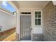 Stylish front door and brick facade, creating a welcoming entrance at 2617 Cacao Sq, Acworth, GA 30101