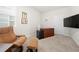 Inviting office space with a cozy chair, a wooden desk, and natural light at 2617 Cacao Sq, Acworth, GA 30101