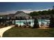 Community pool and clubhouse with fenced-in pool area and outdoor seating at 2617 Cacao Sq, Acworth, GA 30101