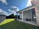 Spacious backyard featuring a covered patio with ceiling fan, grill and comfortable seating at 3220 Montebello Pkwy, Cumming, GA 30028