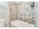 Stylish bathroom showcasing modern tile shower, bathtub, and fixtures offering a spa-like experience at 3220 Montebello Pkwy, Cumming, GA 30028
