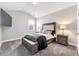 Comfortable bedroom with vaulted ceiling, large bed, and modern decor that provide a serene and stylish retreat at 3220 Montebello Pkwy, Cumming, GA 30028